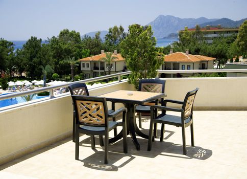 table and chairs in tourist resort in a hot canicular day