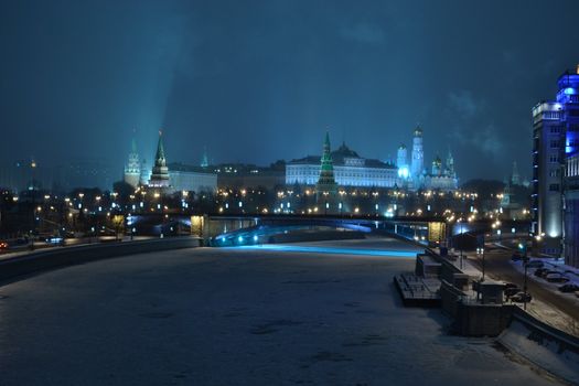 Night view of the frozen Moscow river and the Kremlin