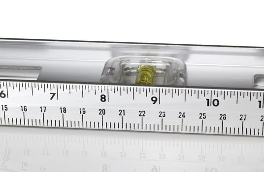 Yellow spirit level in aluminum measuring ruler in inches and cm
