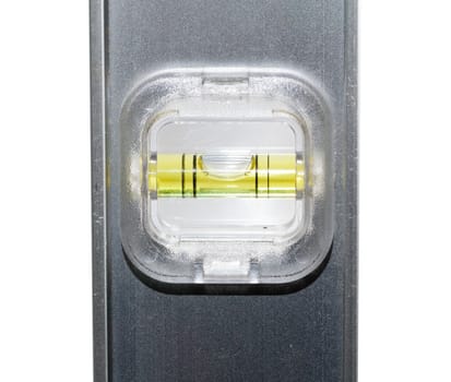 Yellow spirit level in aluminum measuring ruler in inches and cm