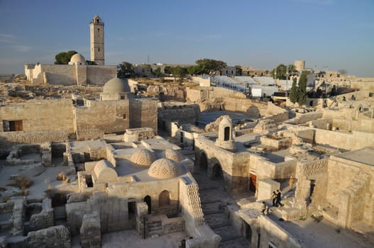 The Citadel of Aleppo is a large medieval fortified palace in the centre of the old city of Aleppo, northern Syria.