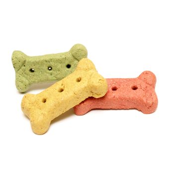 Three various flavoured dog treats isolated over white.
