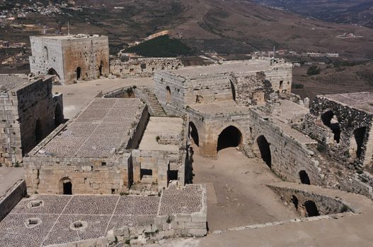 Krak des Chevaliers, transliterated Crac des Chevaliers, is a Crusader fortress in Syria and one of the most important preserved medieval military castles in the world.
