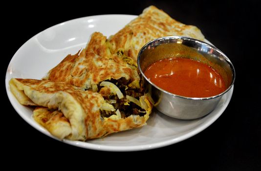 mutton kebab wrap with vegetables,  served with red curry