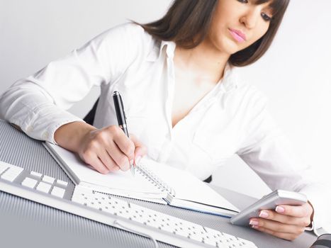 Office Assistant in white writing Schedule