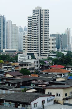 Front suburban home and Back big city building