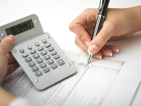 Market Analyze - pen and calculator on papers