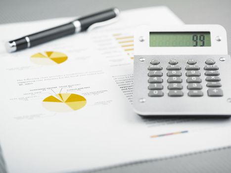 Market Analyze - pen and calculator on papers