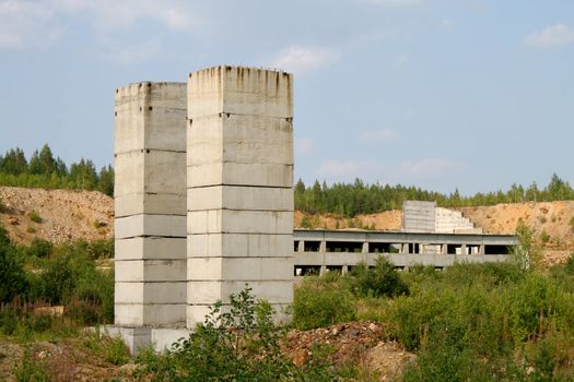 An old strange concrete construction in an opencast mine