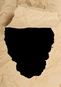 ripped white paper against a black background