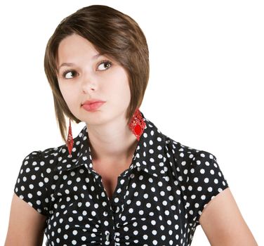 Pensive woman in polka dots over white background