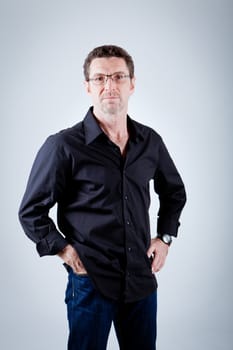 attractive adult man with glasses and black shirt portrait 