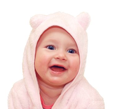 Cute smiling baby girl in a pink towel