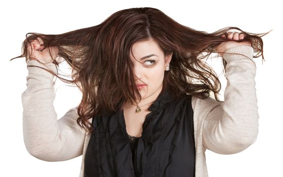 Woman looking over while pulling messy hair