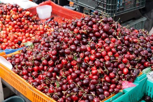 Fresh cherries in box  at a farmers market