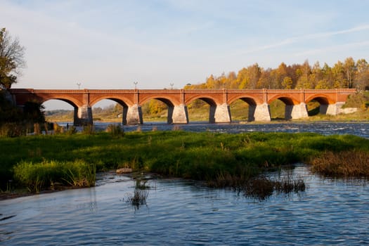 Old brick bridge over river Venta in Kuldiga, Latvia