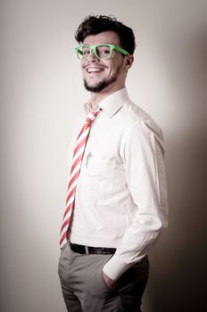 hipster stylish businessman with green eyeglasses on gray background