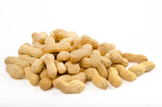 Many peanuts in shells on a white background