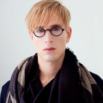 blond modern handsome student man with nerd glasses portrait