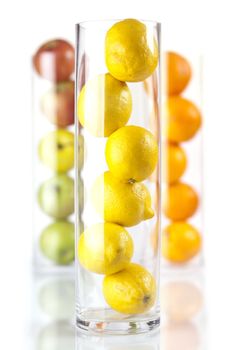 Group of fruit in glass: Lemons, Oranges, Appless