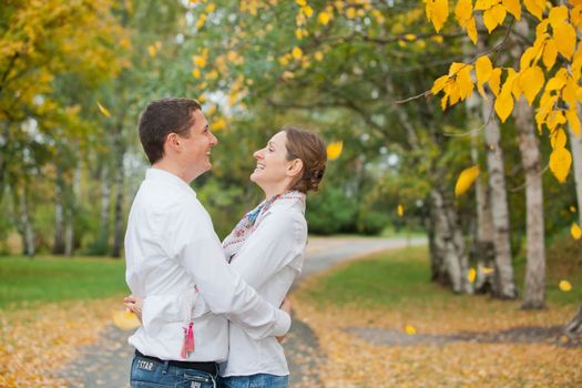Portrait of romantic happy young beautiful couple on autumn walk