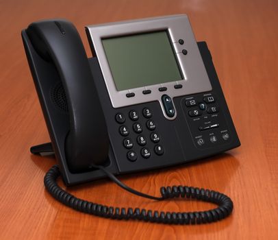 IP Phone standing on a table