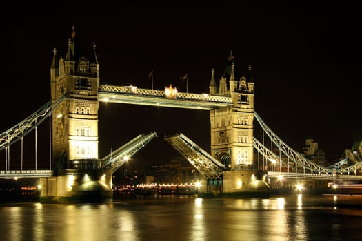 Tower bridge open by night