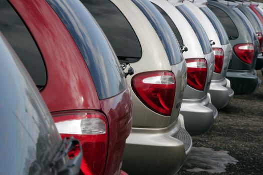 Line of minivans   rear end