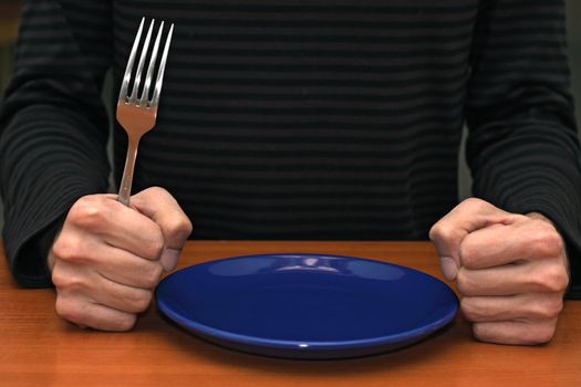 Hands of an angry customer waiting for his meal