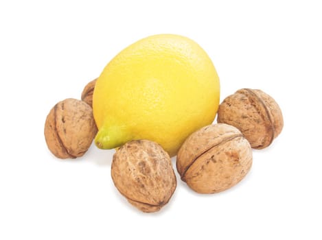 Lemon and walnut on white background