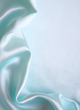 Smooth elegant blue silk as background 