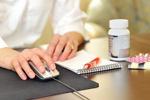 A female doctor making a a prescription