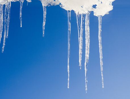 Group of icicles towards blue sky