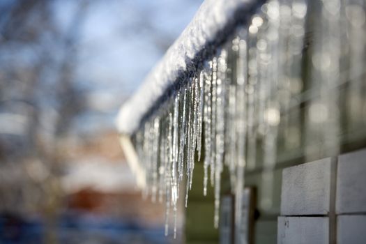 Icicles in a row with selective focus