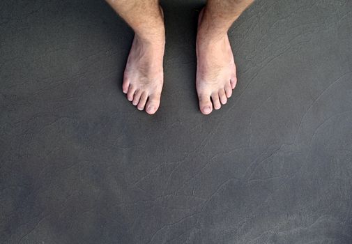 barefoot man on sea beach