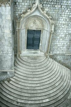 Closed church with circular steps seen from the town wall of Dubrovnik, Croatia.