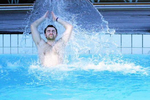 young attractive man relax in spa area