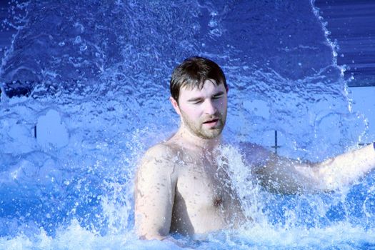 young attractive man relax in spa area