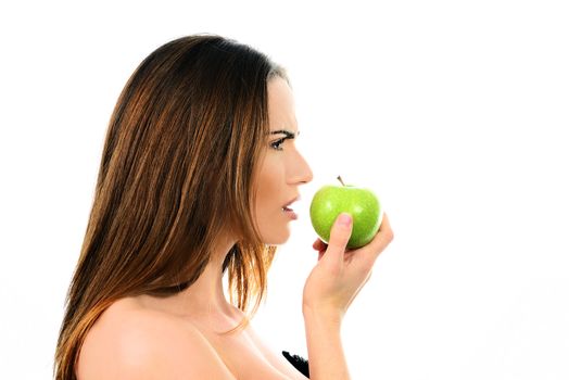 Close-up portrait of sexy caucasian young woman with a green apple
