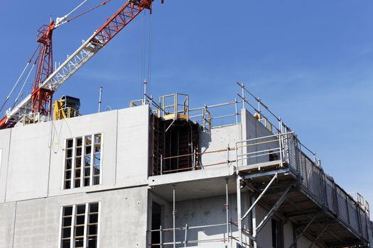 Construction site with crane in blue sky