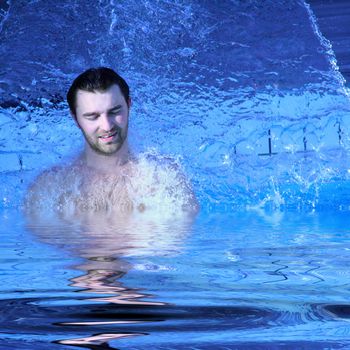 young attractive man relax in spa area