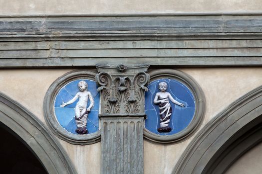 Piazza della Santissima Annunziata in Florence. Ospedale degli Innocenti. Ceramic  tondo by Andrea della Robbia 