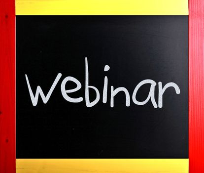 The word "Webinar" handwritten with white chalk on a blackboard