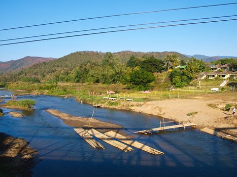 Bamboo rafts in Pai river viewed from Memorial bridge in Pai, Mae hong son, Thailand