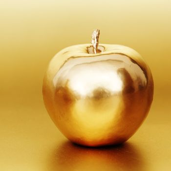  gold apple on gold background