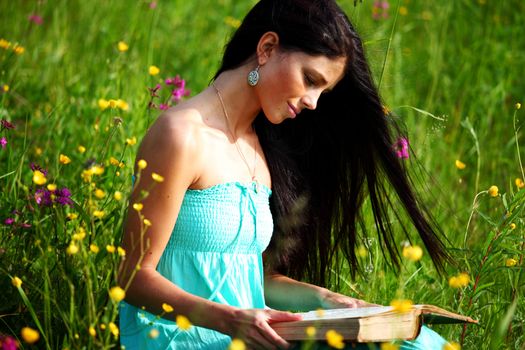  girl with book under big tree