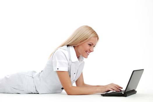 business woman lies and working on laptop