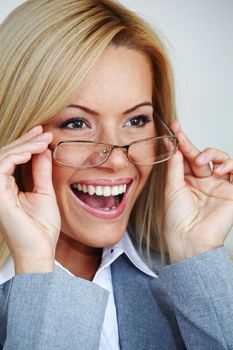 business woman in glasses on gray background