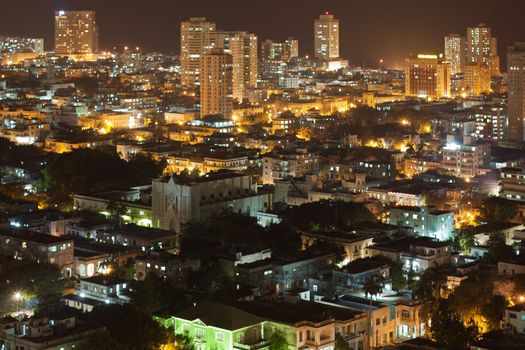 Aerial view of modern quarter of Vedado in Havana, Cuba, at night.