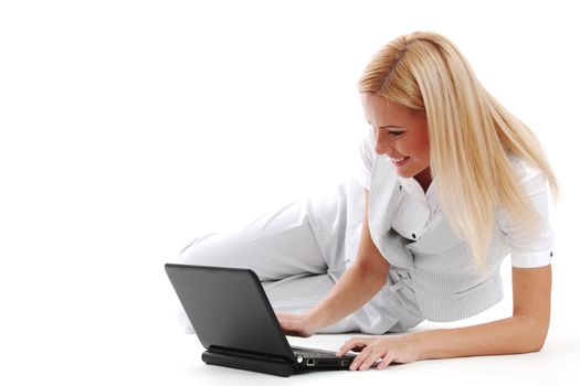 business woman lies and working on laptop